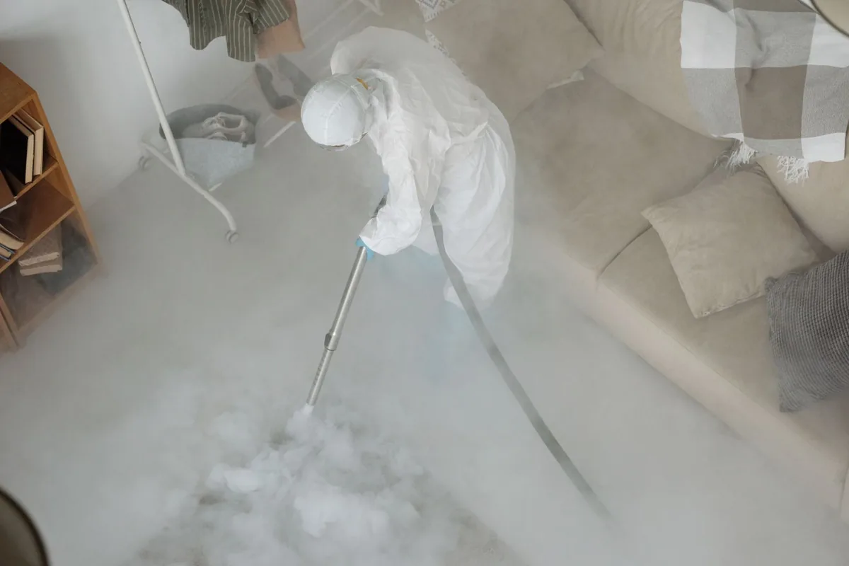 Biohazard cleanup technician in protective equipment, Winchester, CA